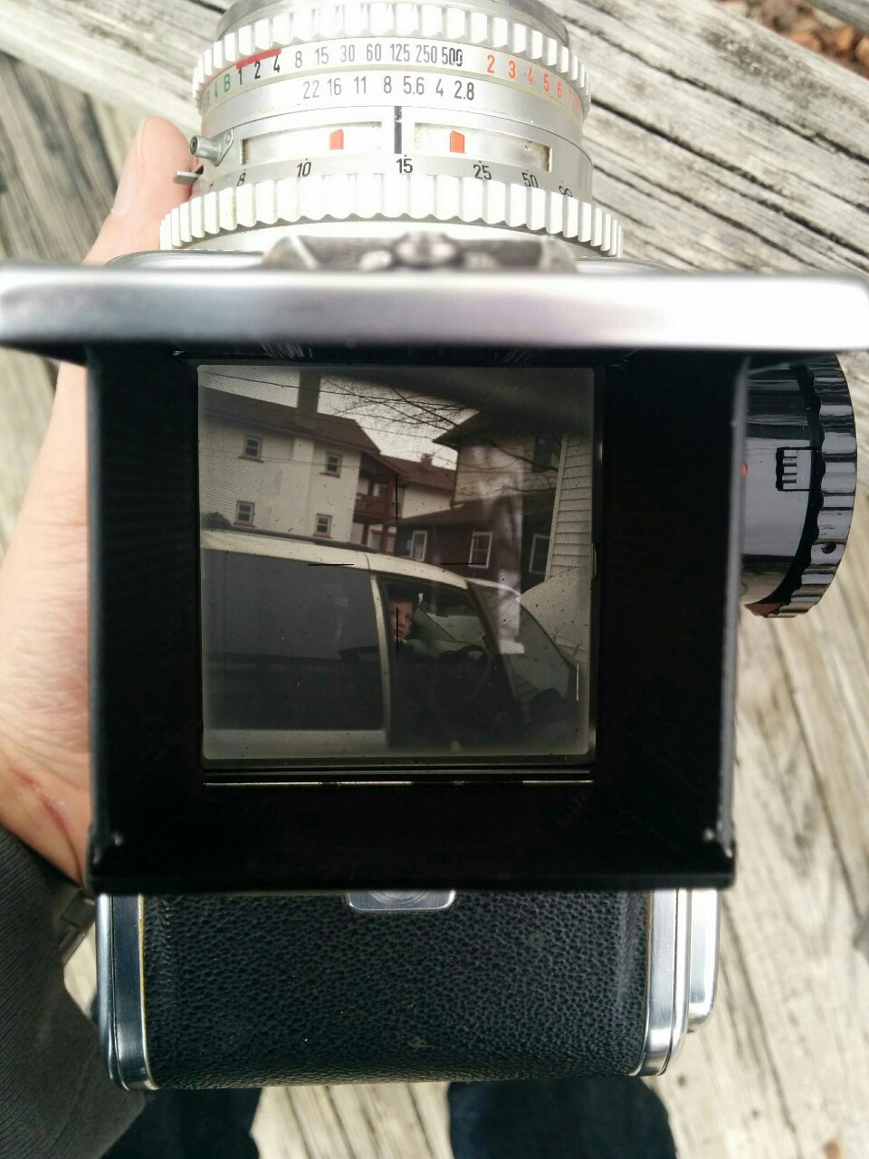 The Hasselblad 500C viewfinder is a waist-level viewfinder. The viewfinder is at the top of the camera, and you look down into it.